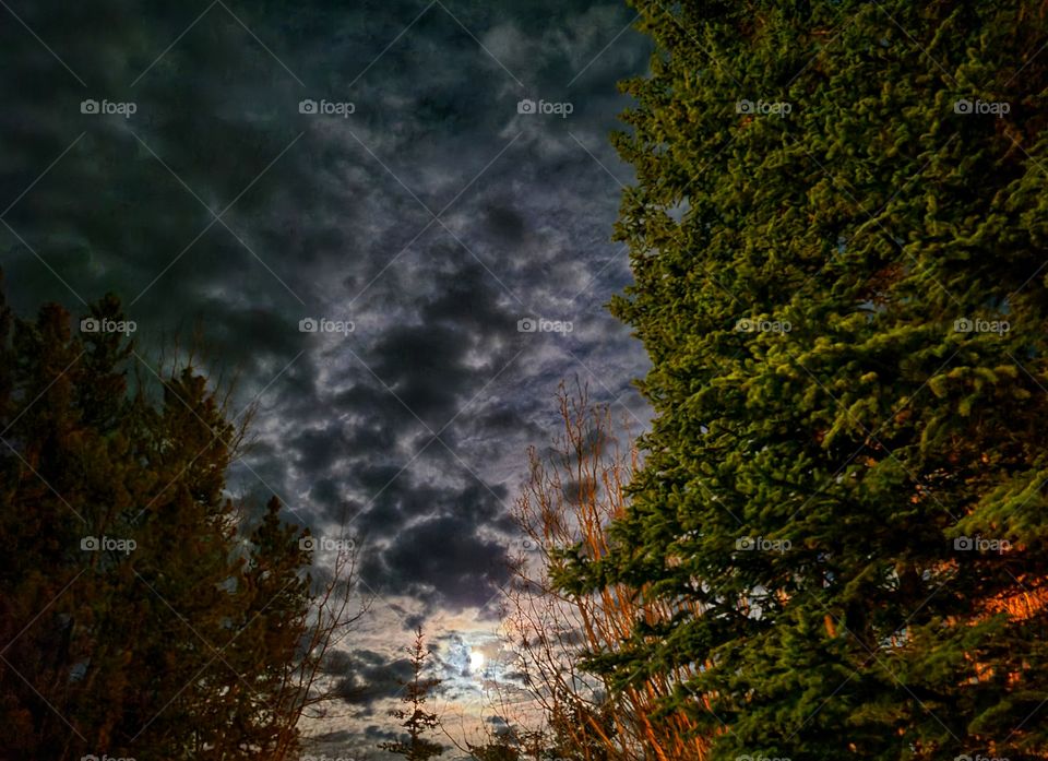 Full moon and scattered clouds