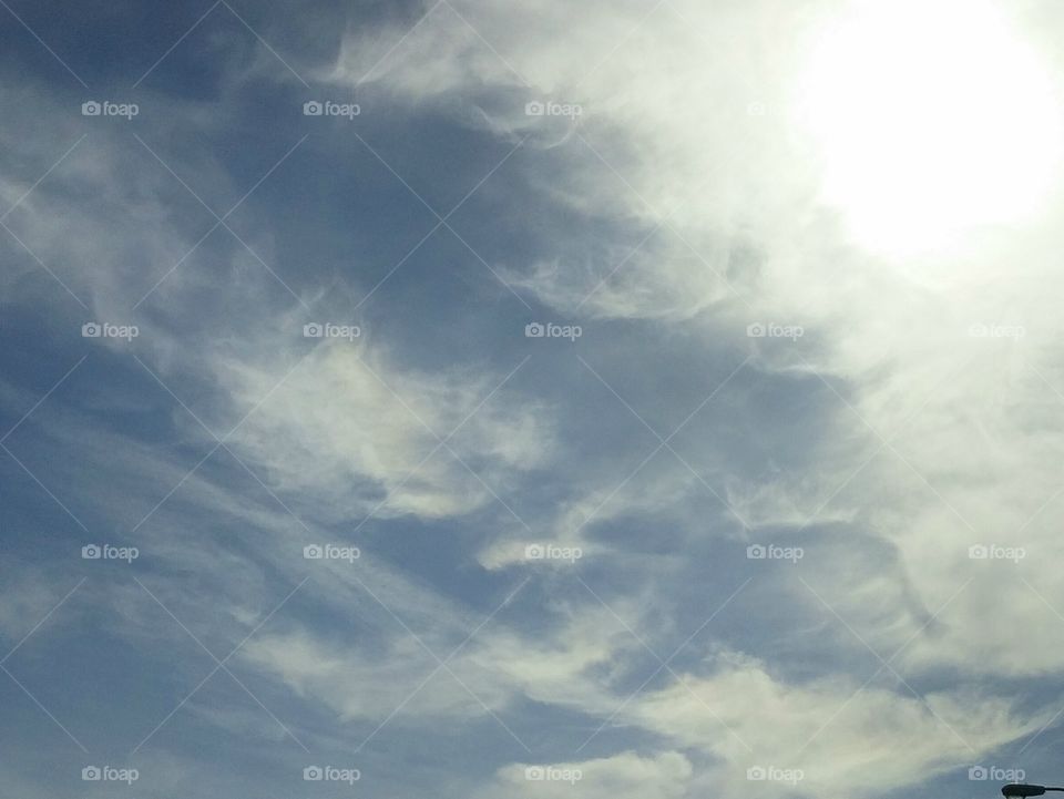 Afternoon Sky. White clouds in perfectly blue skies