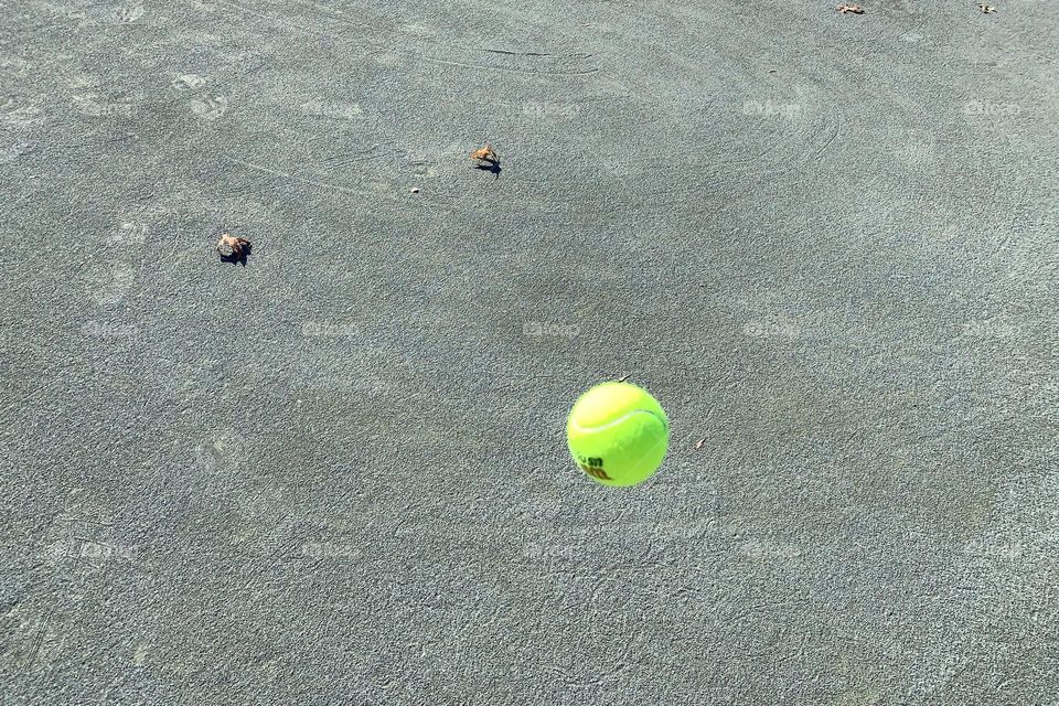 One bouncing tennis ball 