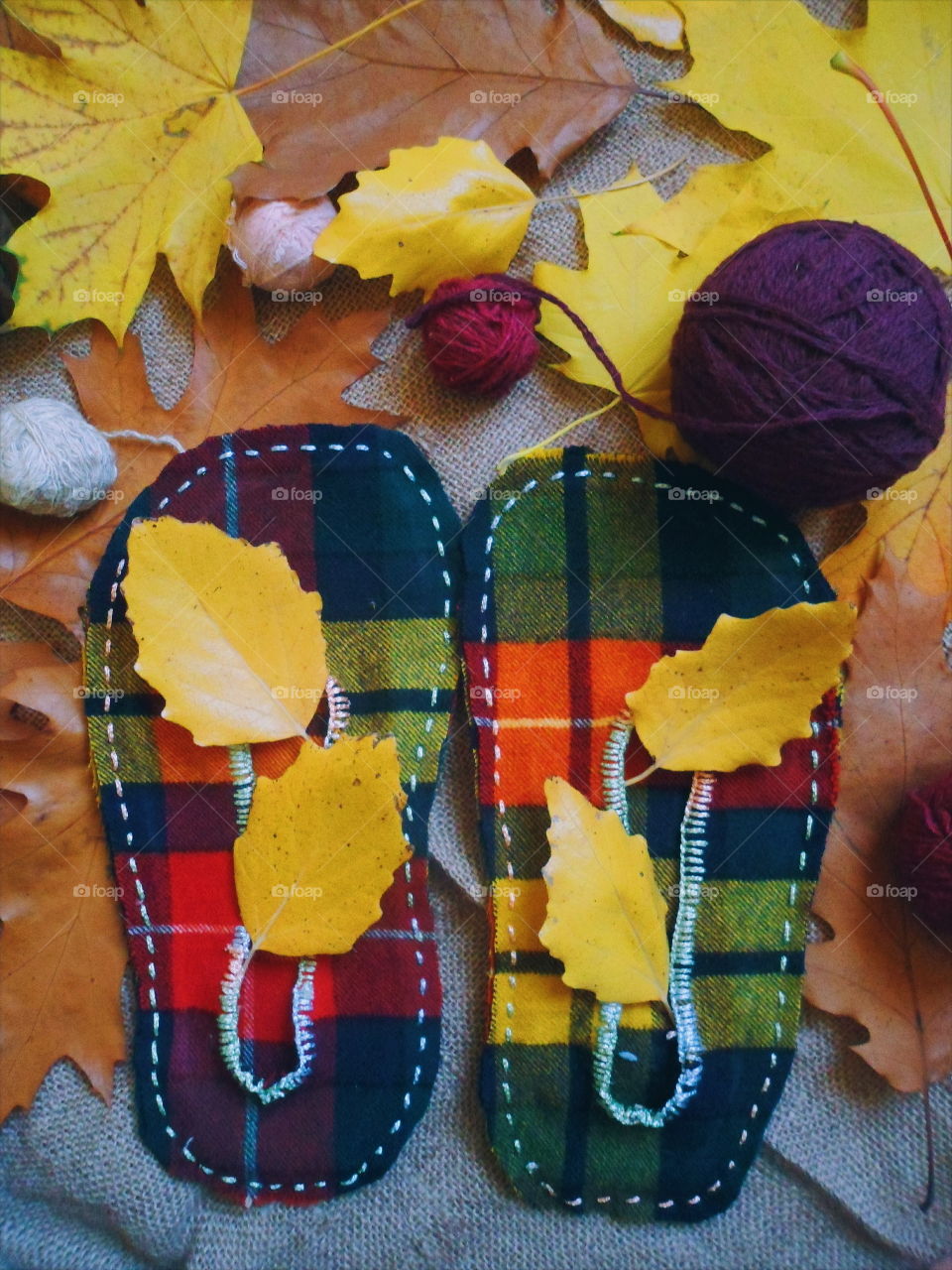 stitched warm slippers and autumn leaves