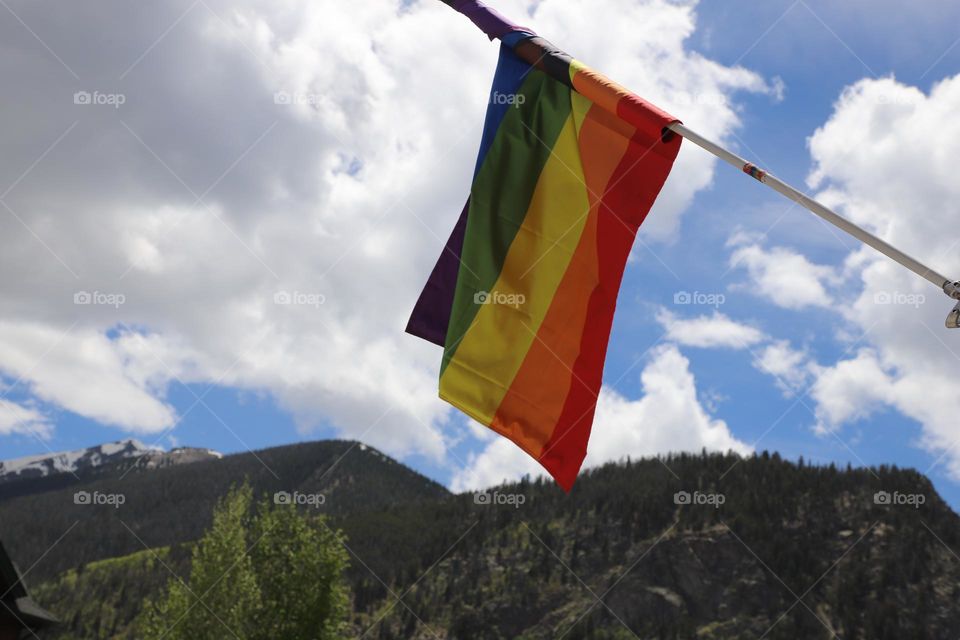 Multicoloured flag waving on the wind