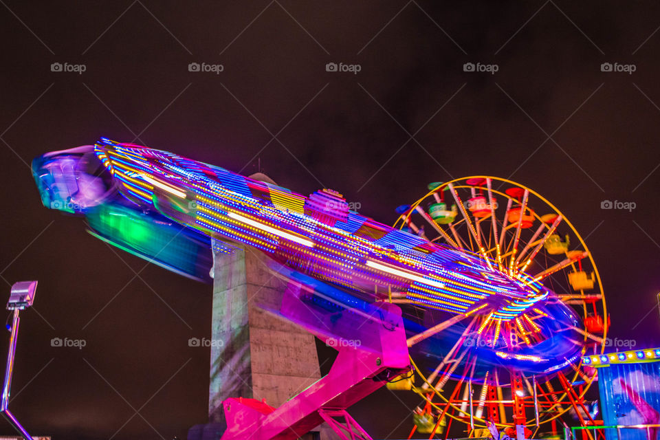 Amusement park illuminated at night