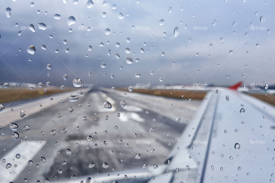 rainy window of an airplane