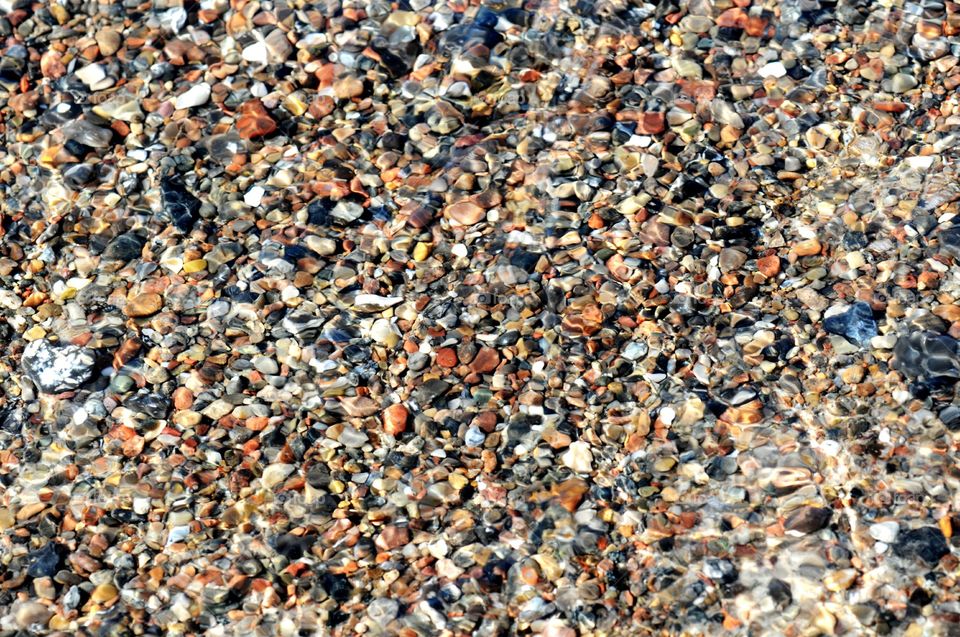 waves flowing over the pebbles on beach. baltic sea