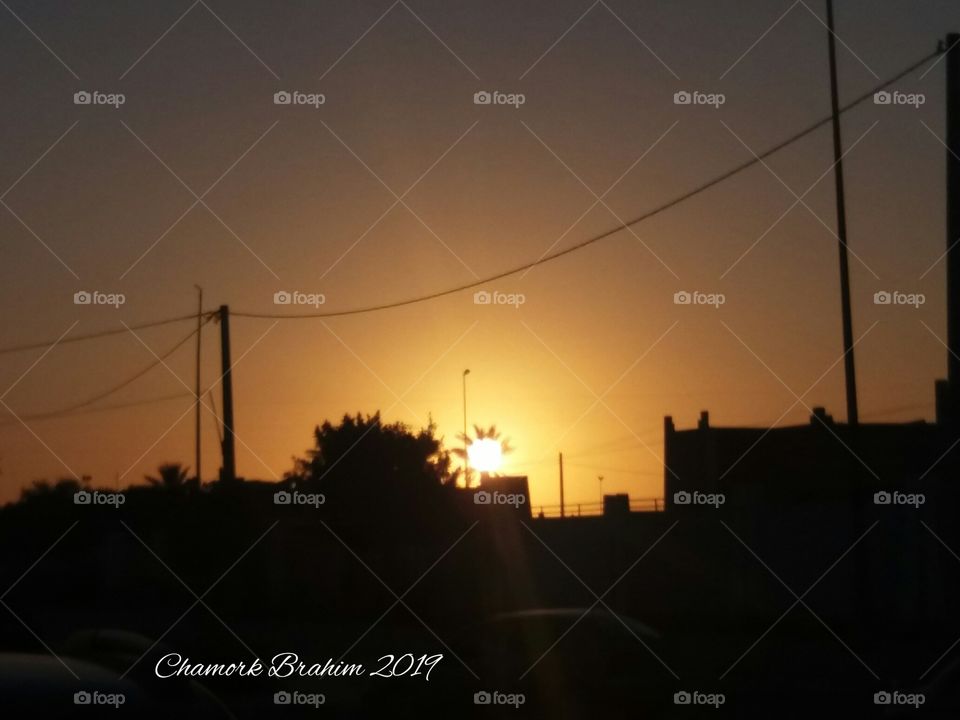 when we came out from a high school in the envening ,I noticed this beautiful view of sunset.I tried to capture this amazing moment .It was soo wonderful.