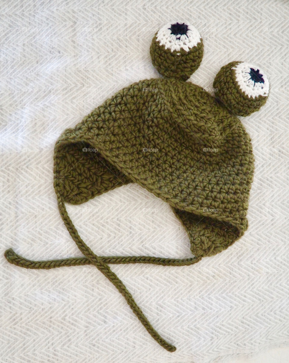 Hand made crochet green frog hat or bonnet with funny eyes.