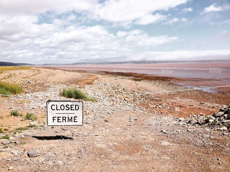 Red beaches exposed at low tide at the Bay of Fundy, Canada 