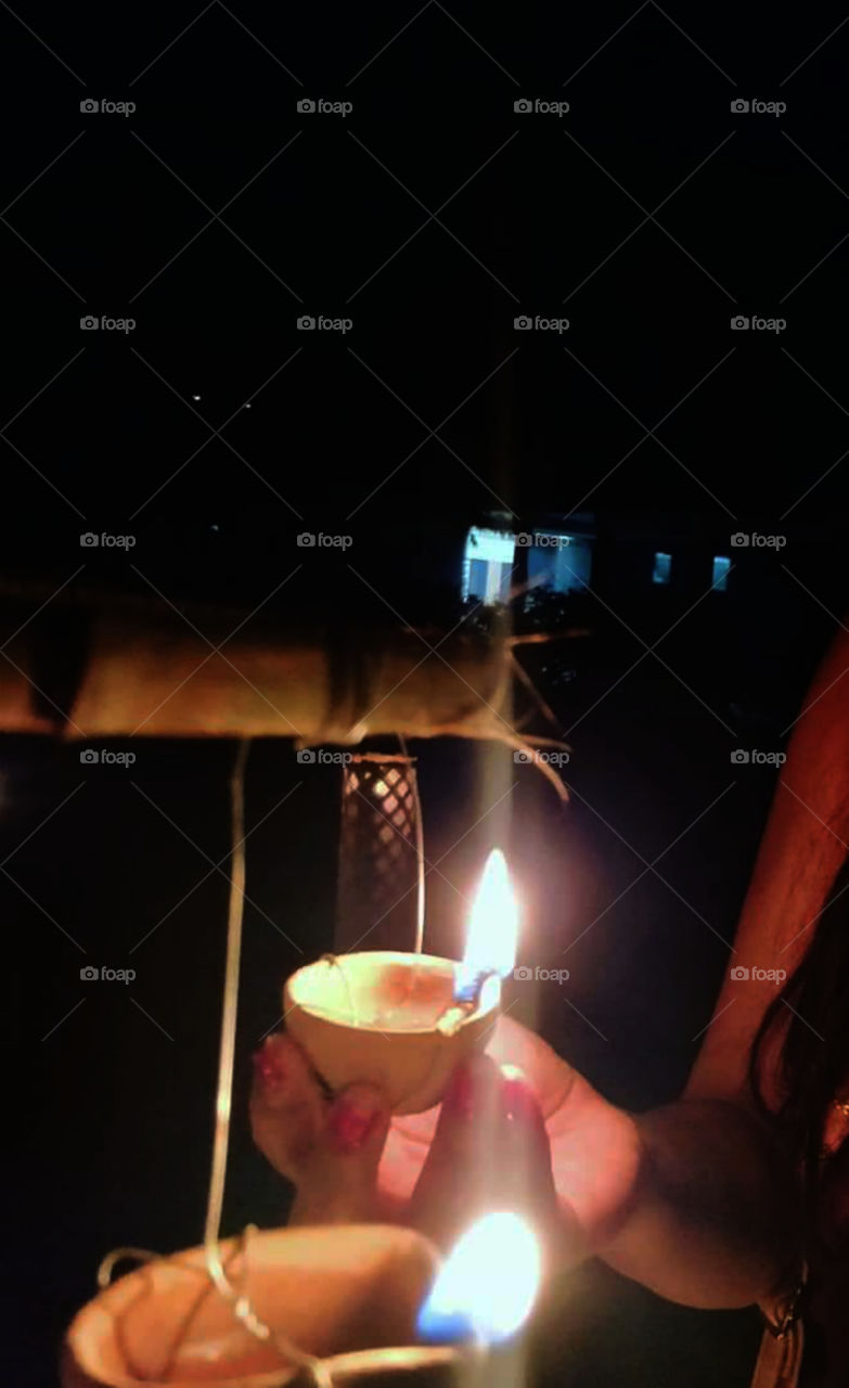 A Girl holding an earthen oil lamp.Diwali, festival  of lights