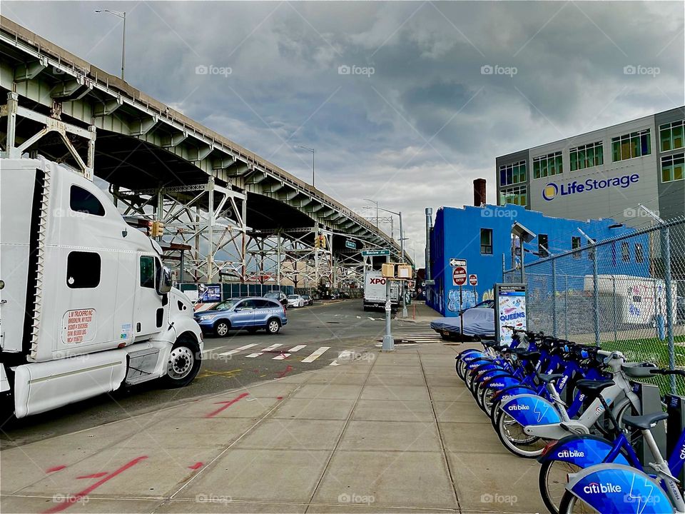 This is another view of the downward sloping “Brooklyn Queens Expressway” or “BQE” overpass running parallel to “Borden Avenue” and the “Borden Avenue Bridge” over “Dutch Kills” at “Hunters Point” in LIC, Queens. 2023. Hypnotic Productions