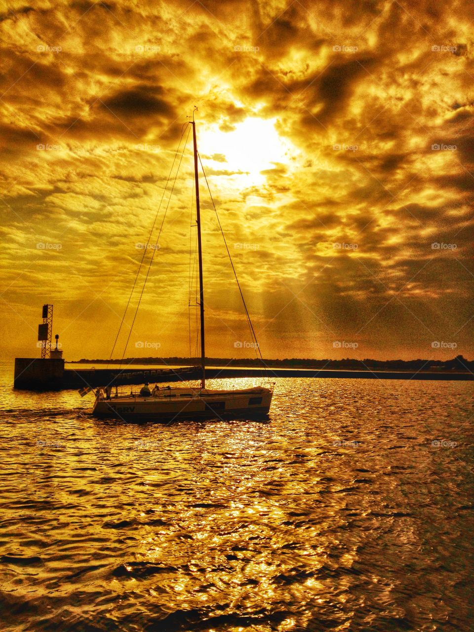 Nautical vessel on sea during sunset