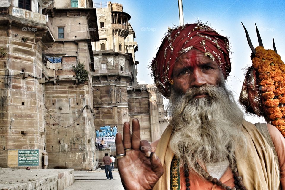 Om - the word has one hundred meanings . Man asks me to take his photo in Varanasi 