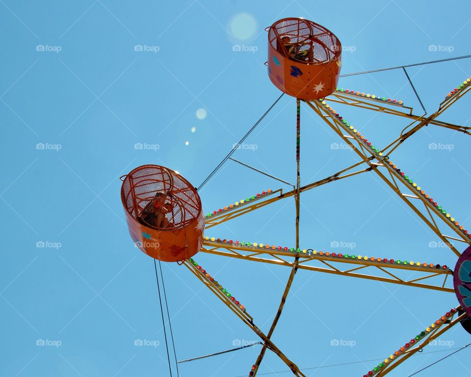 Carnival ride, blue sky 