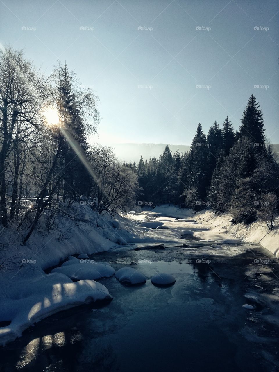 Scenic view of stream during winter