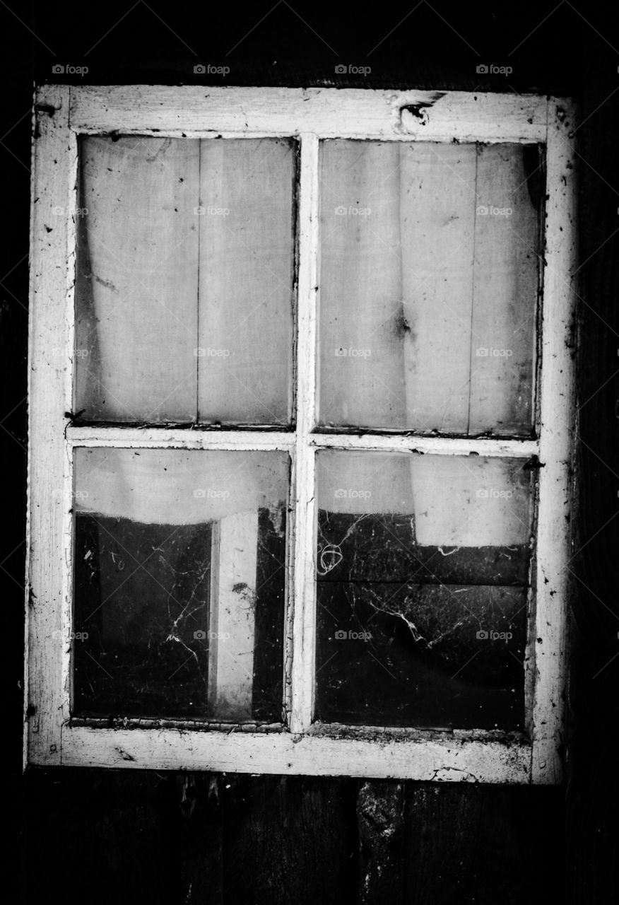 Window. A very old and dirty window on a old house