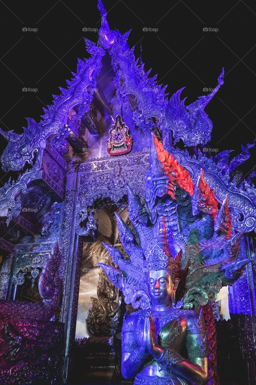 Beautiful Wat Sri Suphan (The Silver Temple) bathed in purple light