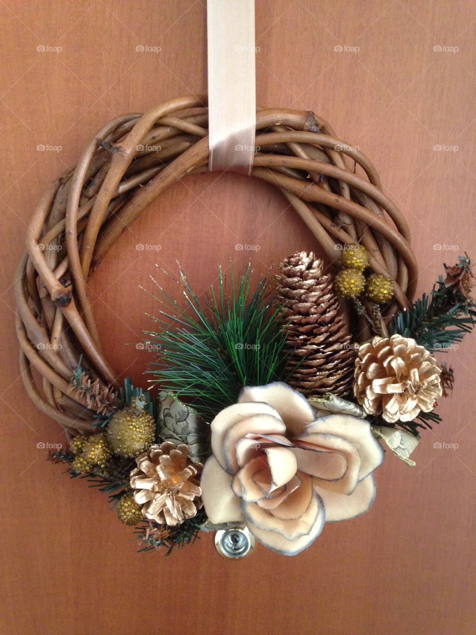 Flower wreath on wooden background
