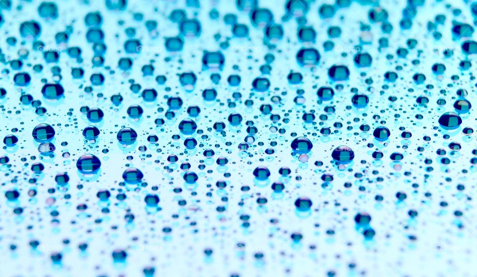 Abstract background with shiny water drops, rain on the glass.