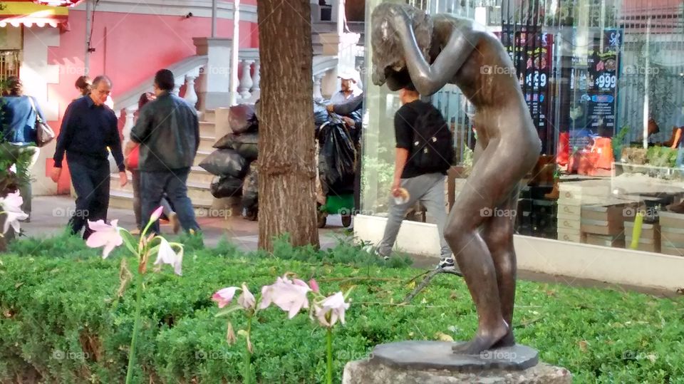 Woman taking a shower. statue of woman taking bath at Genova street, Zona Rosa, Mexico City