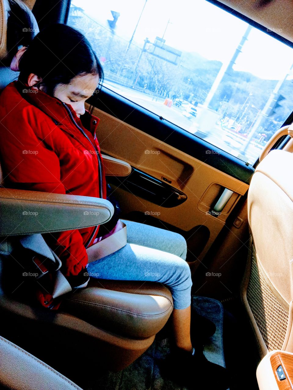 The blind girl inside the car , can't see anything what's happening outside.
But she can feel and imagine what's out there.