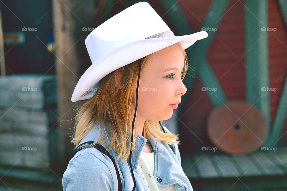 Cowgirl. A girl in cowboy hat