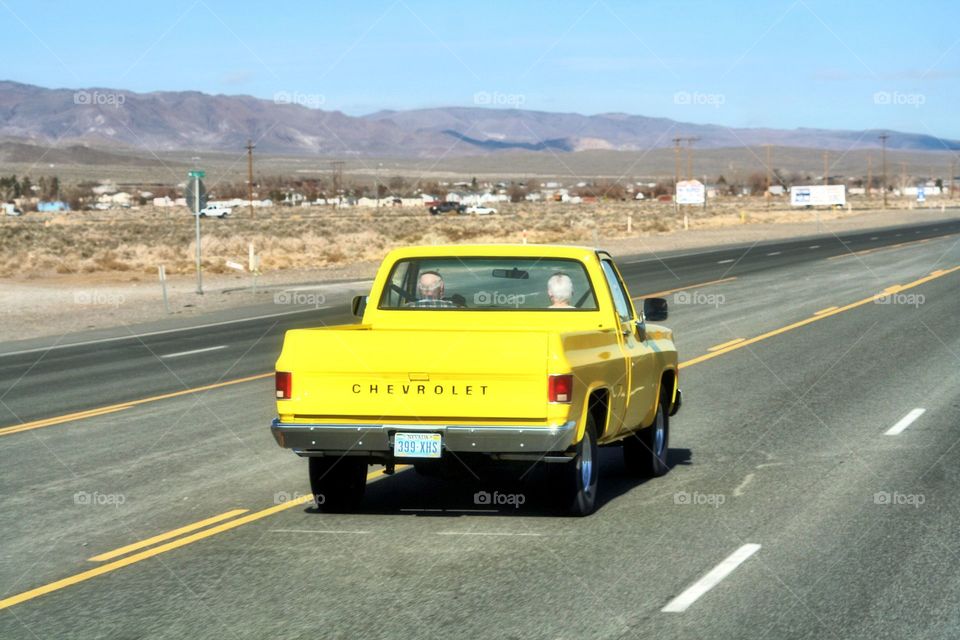 Priceless. Couple rolling down the main drag in a classic.