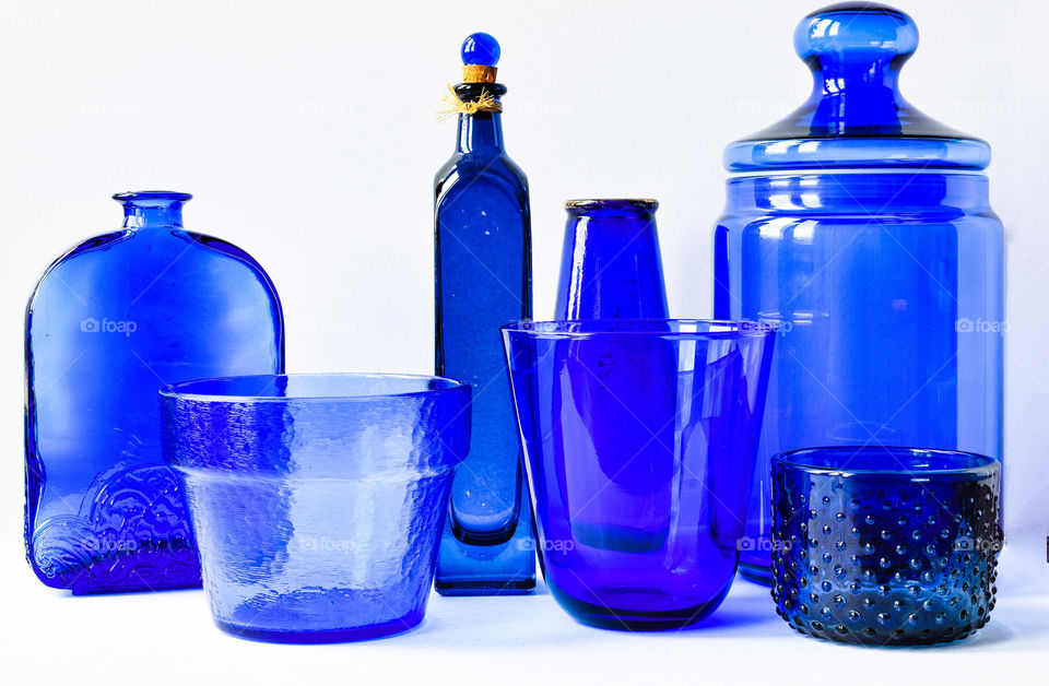 Blue bottles in white background 