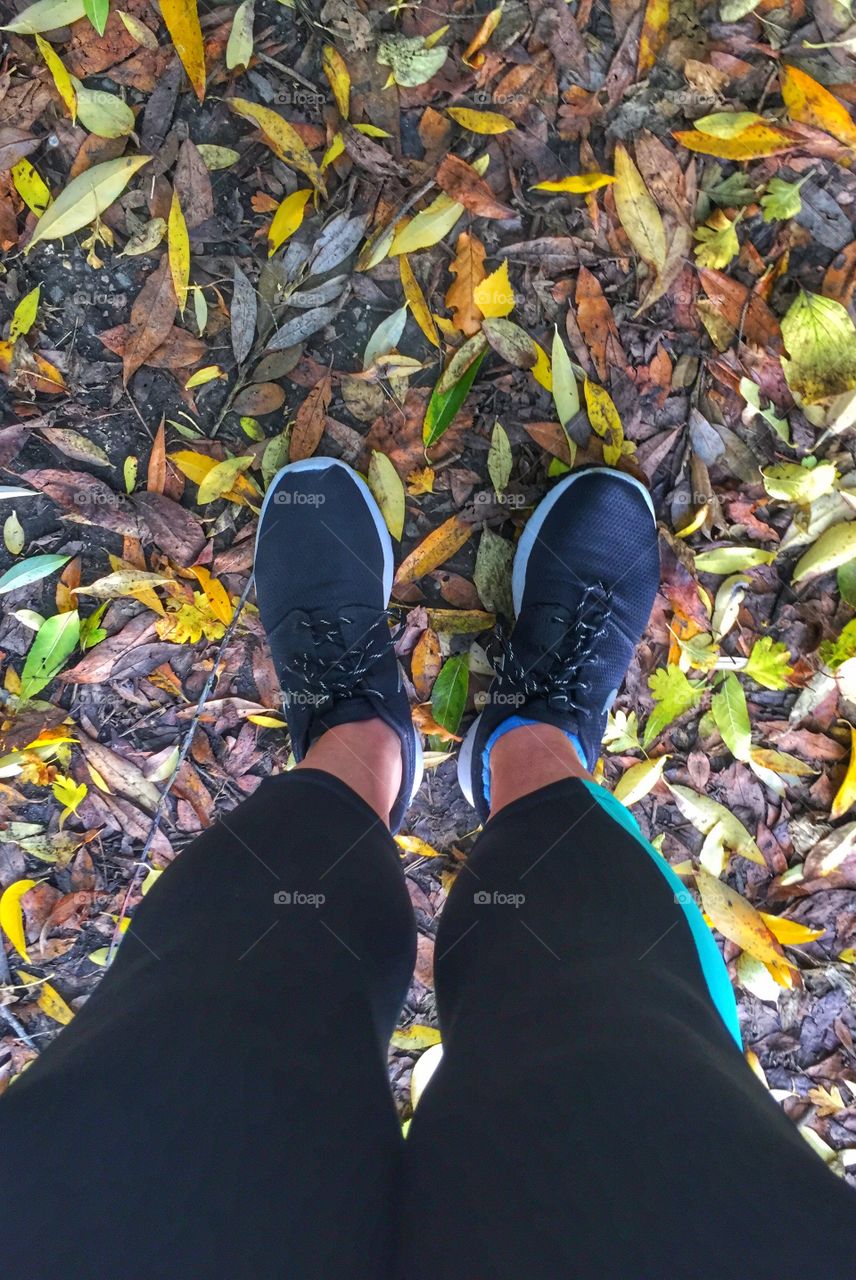 Low section of woman exercising in autumn