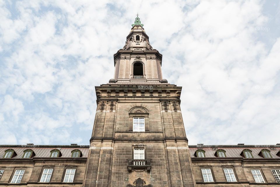 Looking up on  amazing architecture and tower of Christianborg castle in Copenhagen Denmark 