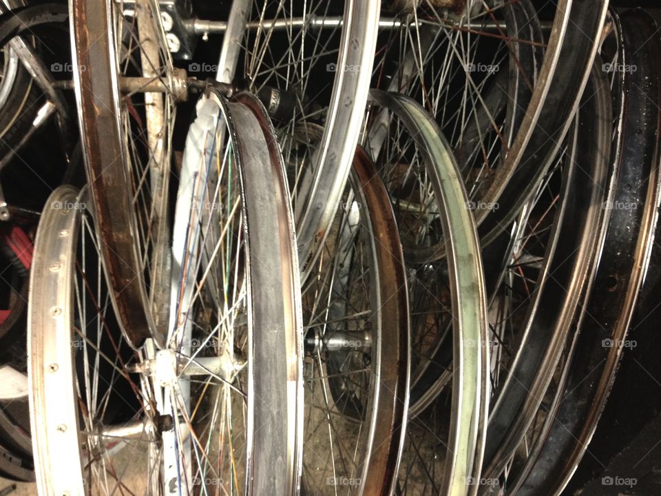 Parts hanging up in the community bike shop. 