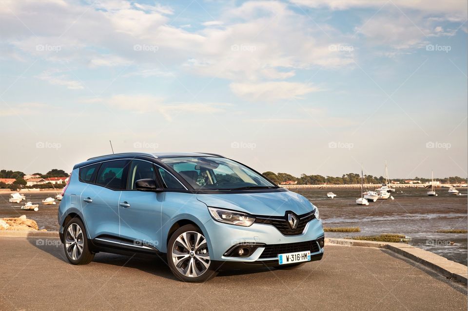 A Nice Picture Of A Blue Renault Seden By The Coastline Just Parking There Enjoying The Lovely View,have a nice day.