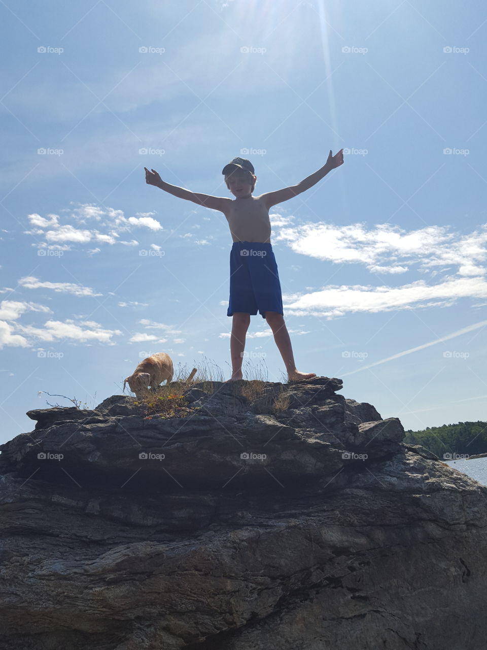 Boy on top of Rocks