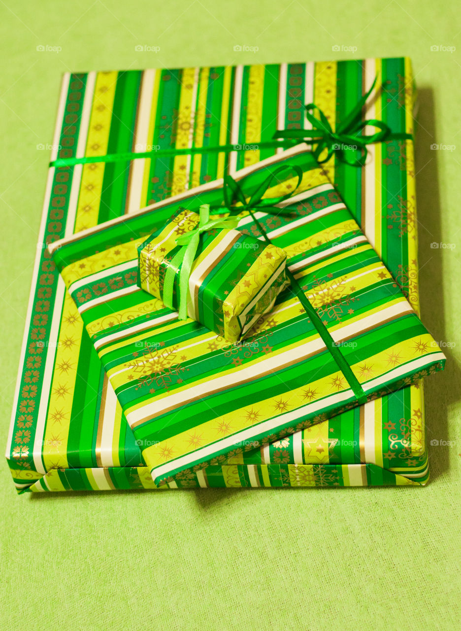 Presents decorated with green paper 