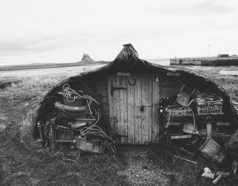 Upturned boat recycled into a little hut ... B&W