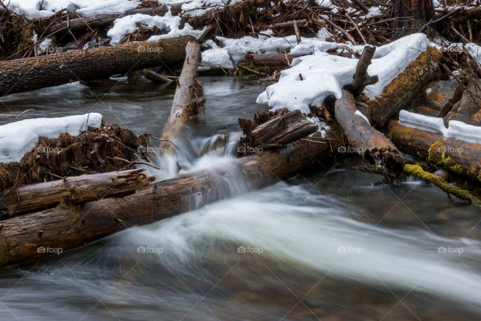 Flowing mountain stream in the winter