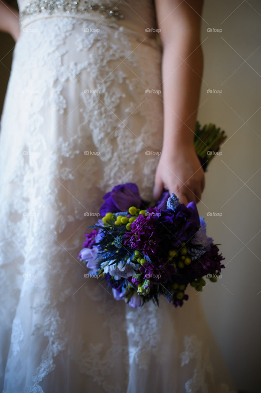 Bride Before Wedding Ceremony Holding Gorgeous Purple Bouquet - Beautiful Lace Detail on Ivory Wedding Dress Up Close 