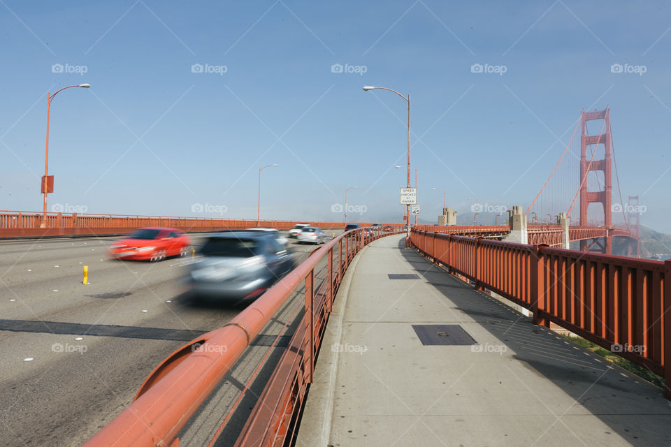 Cars moving along on The Golden Gate Bridge 