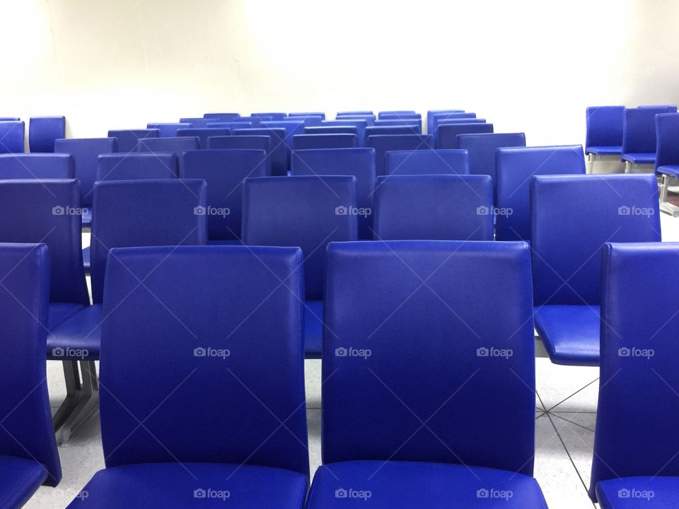 Blue chairs in the room with white background 