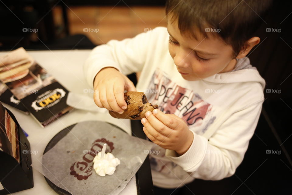 boy eating dessert