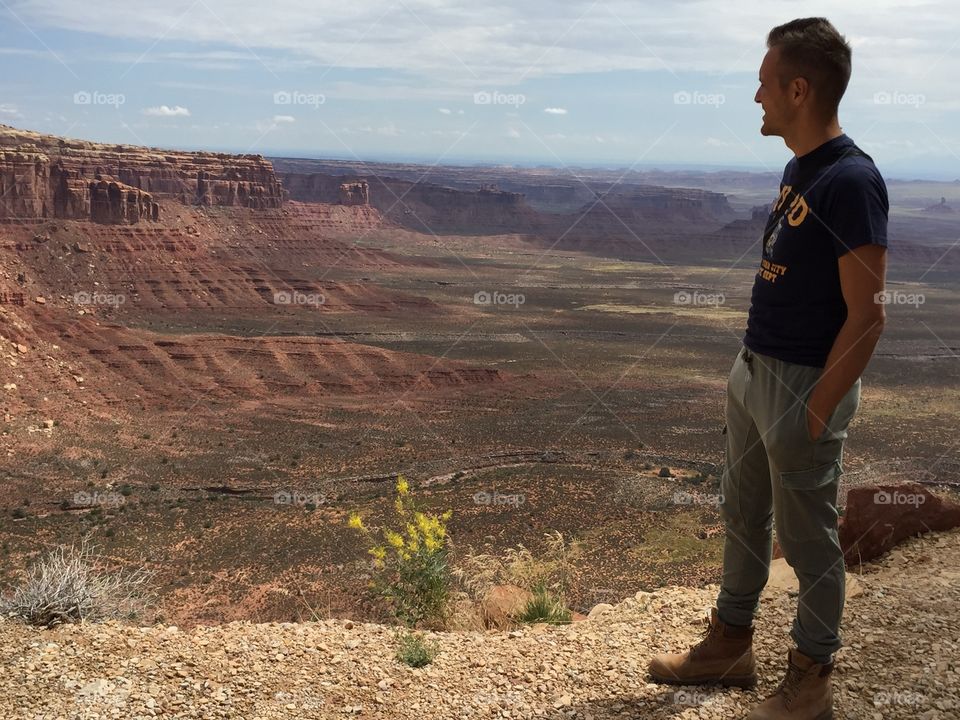 Side view of man standing on hill