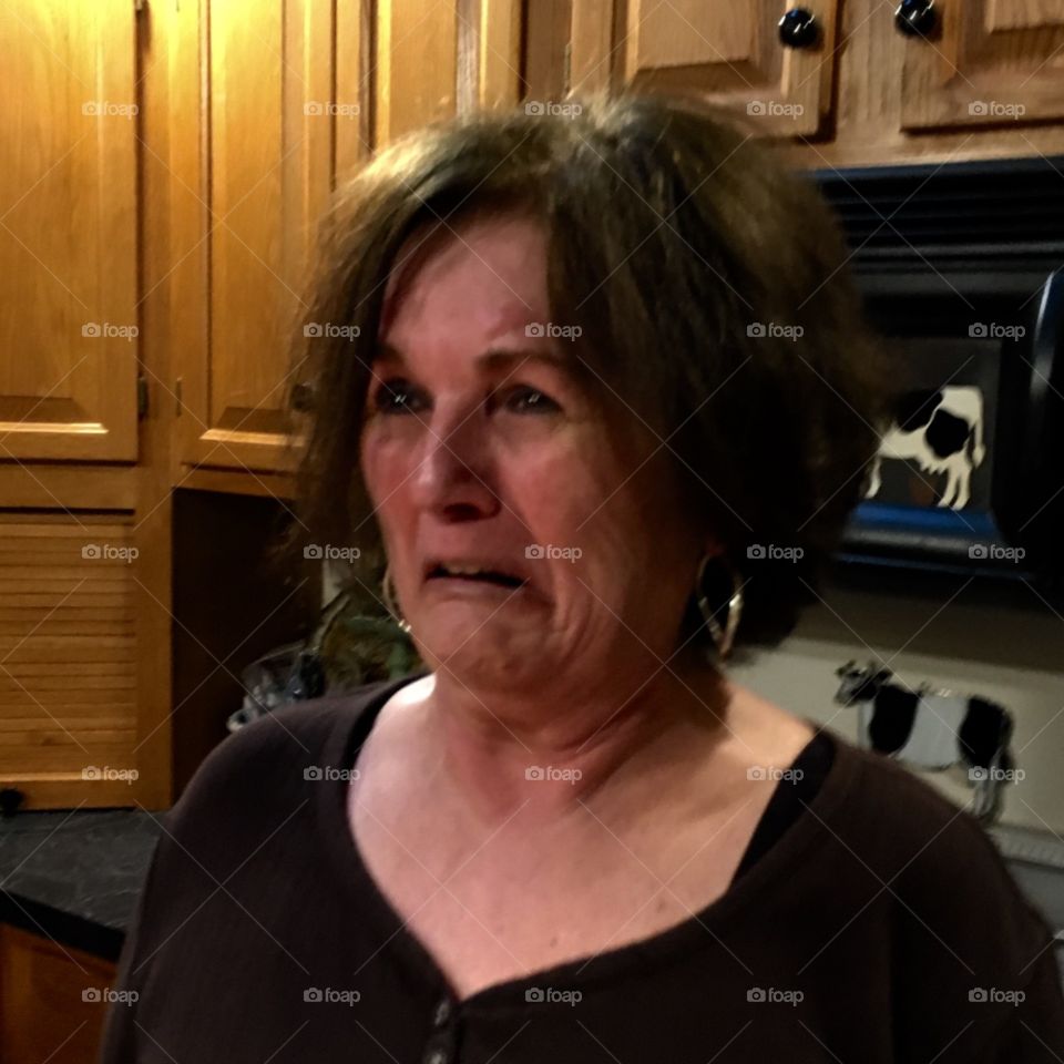 Facial expression on woman, sadness, or sour, spoiled taste of something she ate.