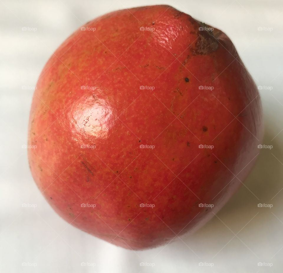 one ripe tree pomegranate on white background 