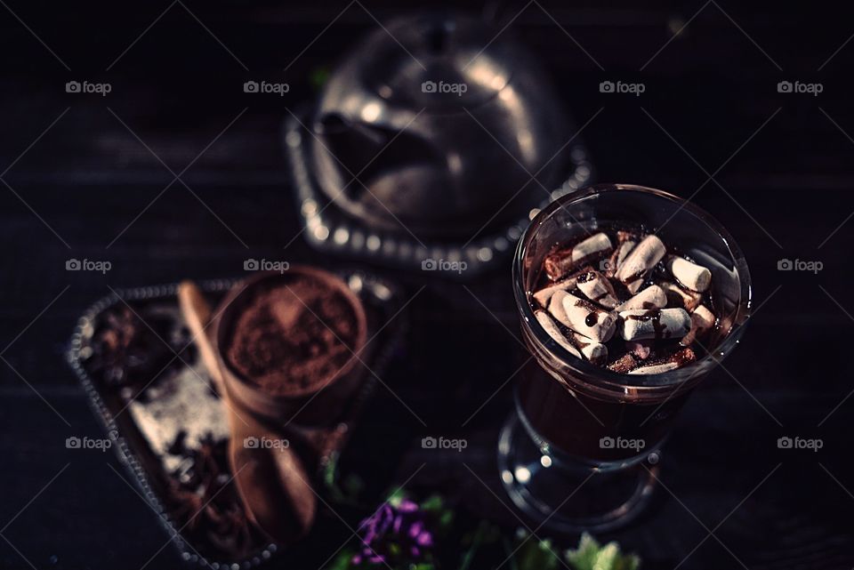 Hot chocolate with marshmallows on a wood table 