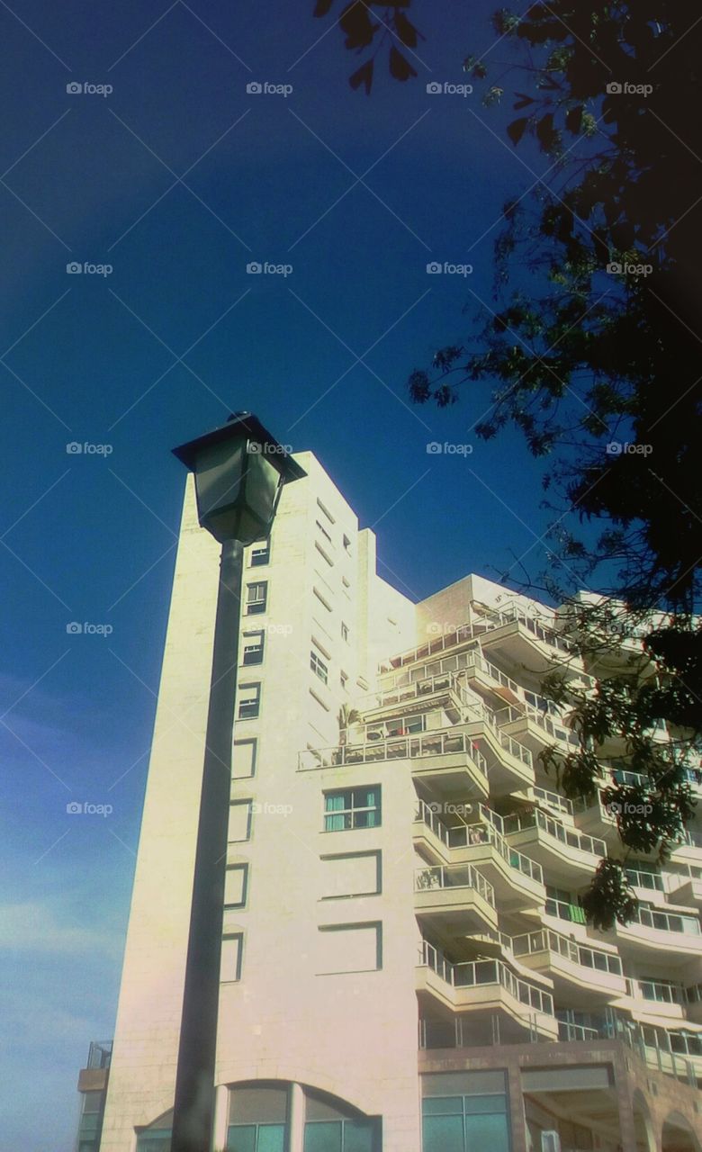 Modern residential building with beautiful
architecture in beautiful day with 
gorgeous blue sky