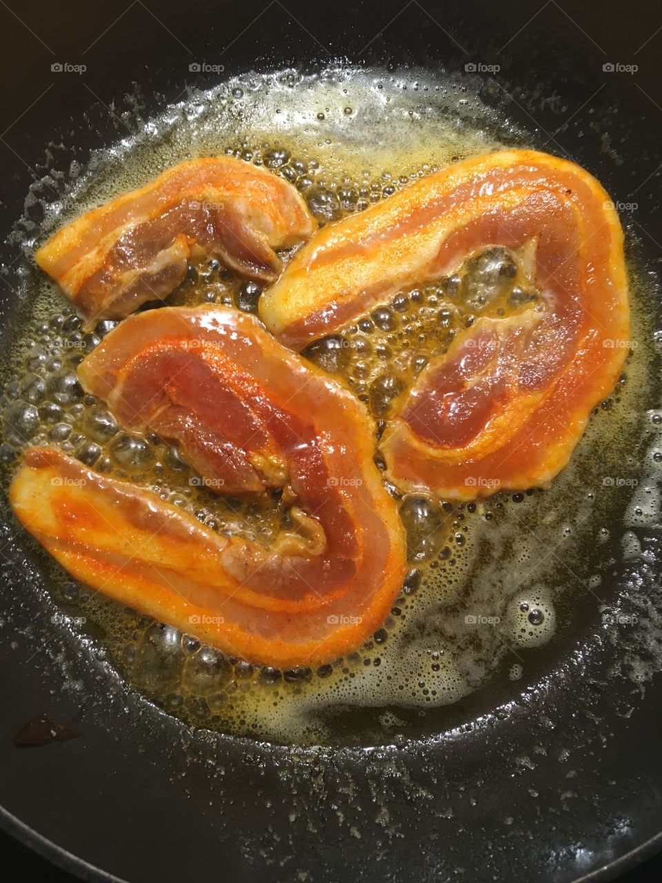 bacon steak in frying pan