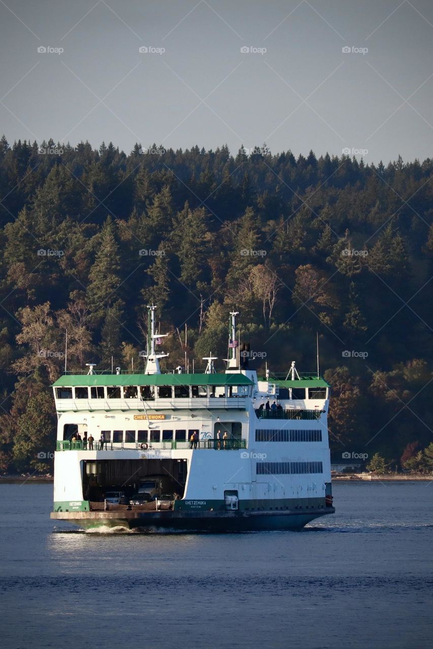 A passenger ferry leaves Vashon Island for Point Defiance, Tacoma, Washington on a clear day