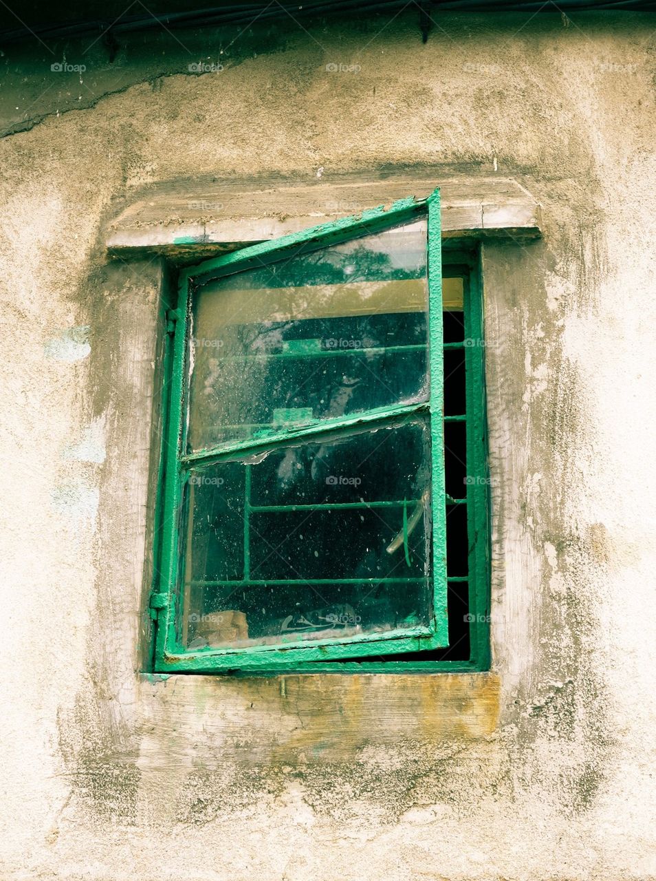 Green window in an old house