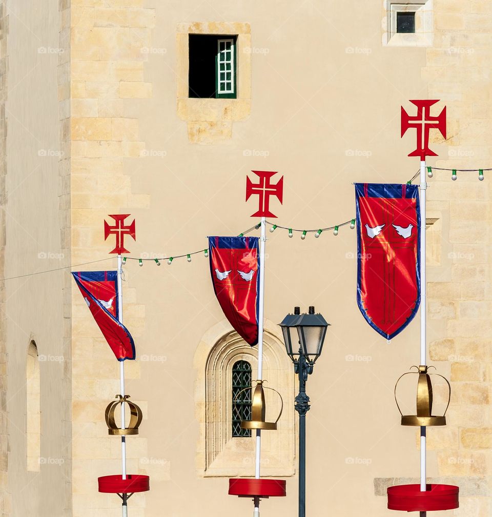 Red flags and Templar Crosses decorate the streets in Tomar, Portugal for Festa dos Tabuleiros 