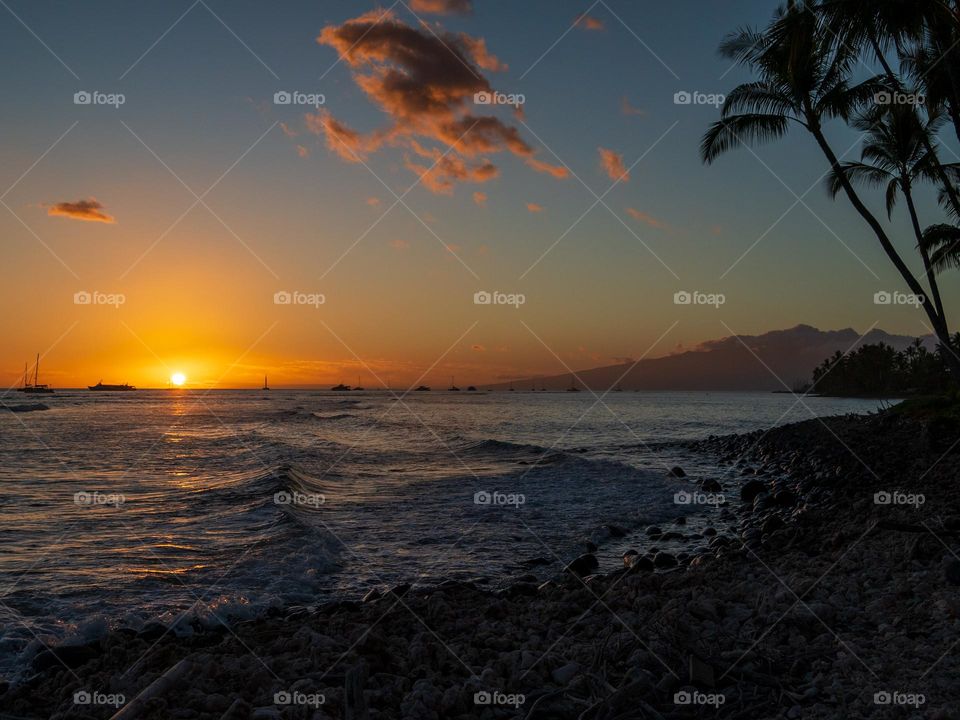 A tropical Hawaiian beach and a gorgeous sunset are a winning combination