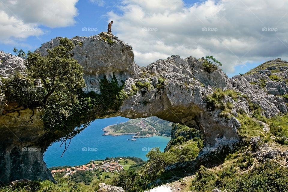 Natural arch of rock on top of a mountain 
