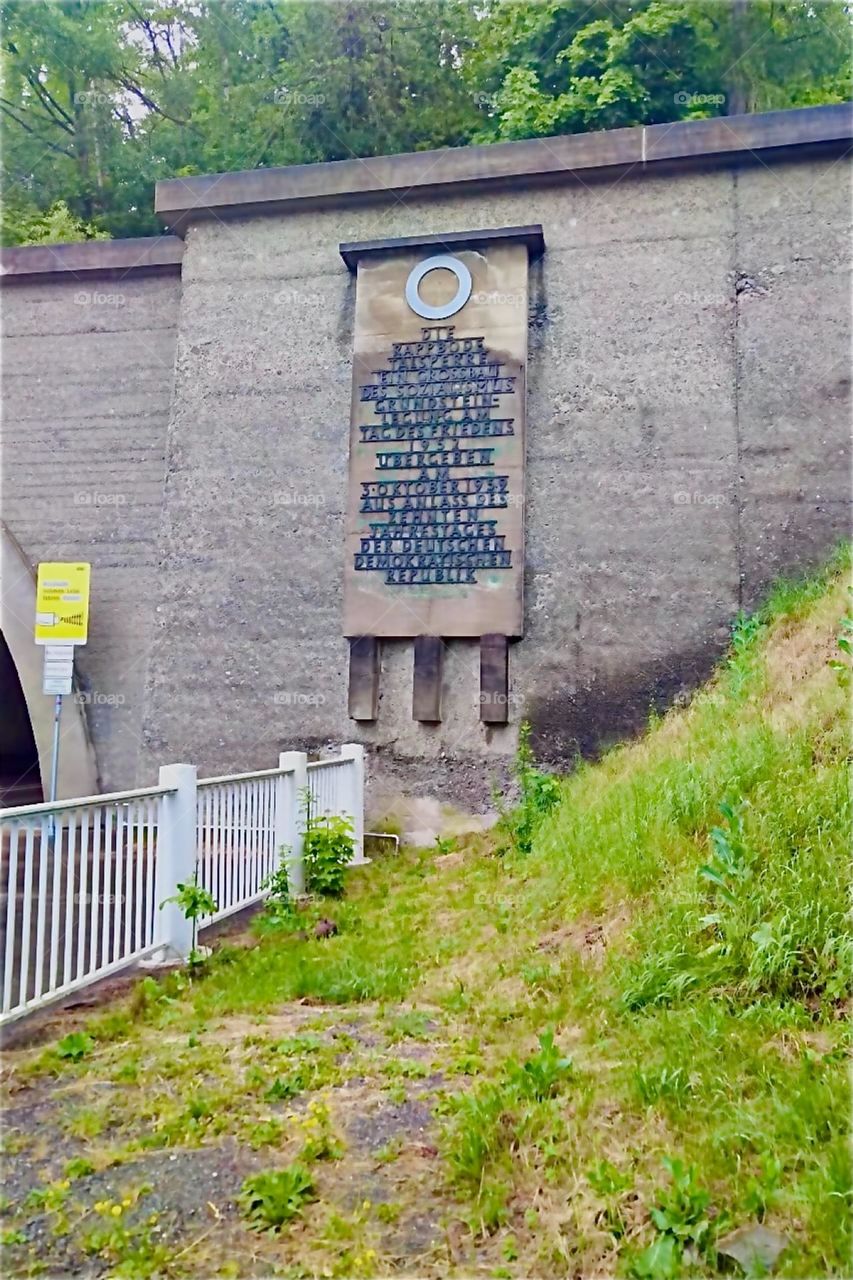 We are in „Saxony-Anhalt“, a territory once in „East Germany“, in the former „DDR“ or „German Democratic Republic“. The sign says the „Rappbode Dam“, a construction of socialism opened on the 10th anniversary of the „DDR“. 2024. Hypnotic Productions